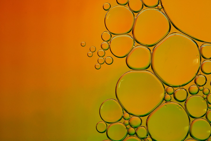 Liquid droplets on a orange and green background